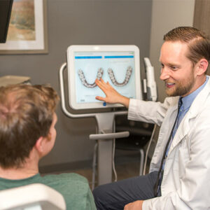 Dr.-Tobler-talking-to-a-patient about Clear Aligners, Ballard Seattle Dentist