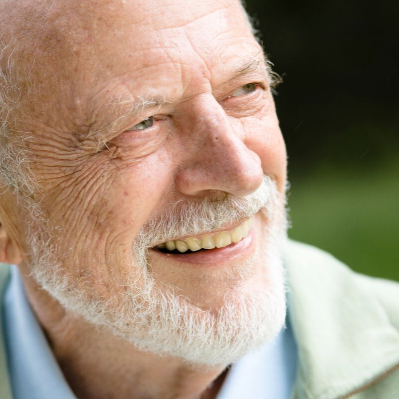 senior man smiling with his new dentures from Ballard Dental Arts